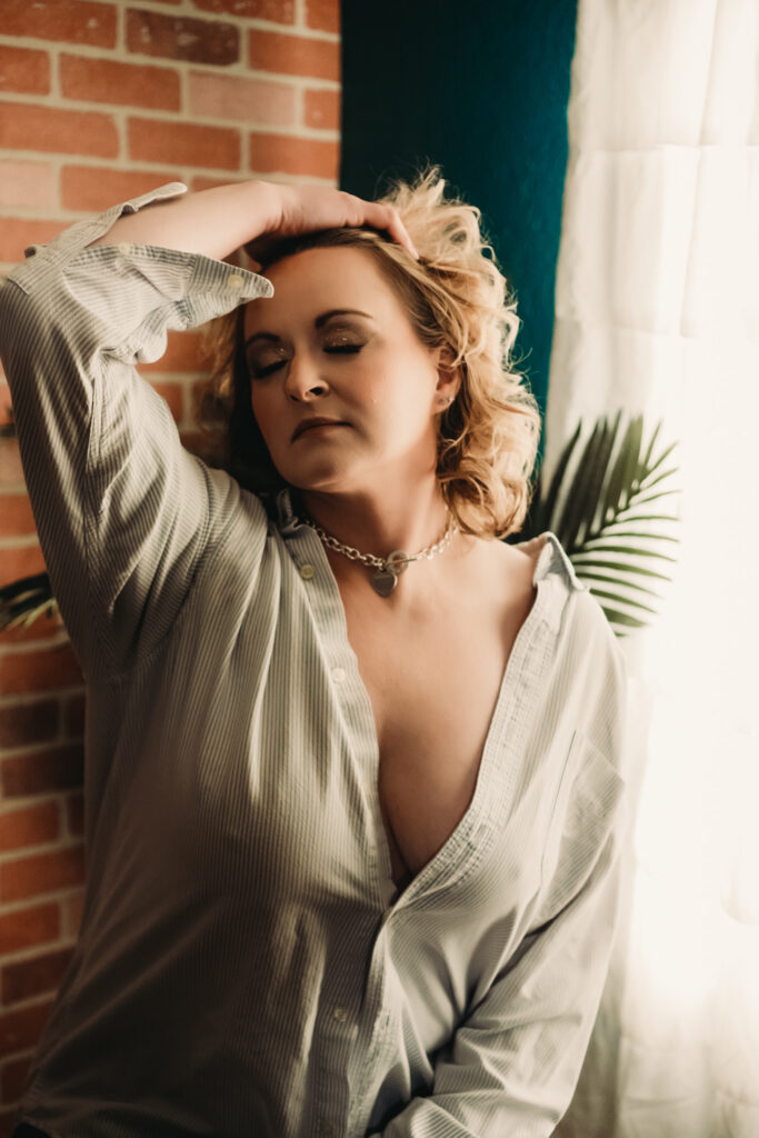 Wearing your husband's shirt for your boudoir session st. louis boudoir