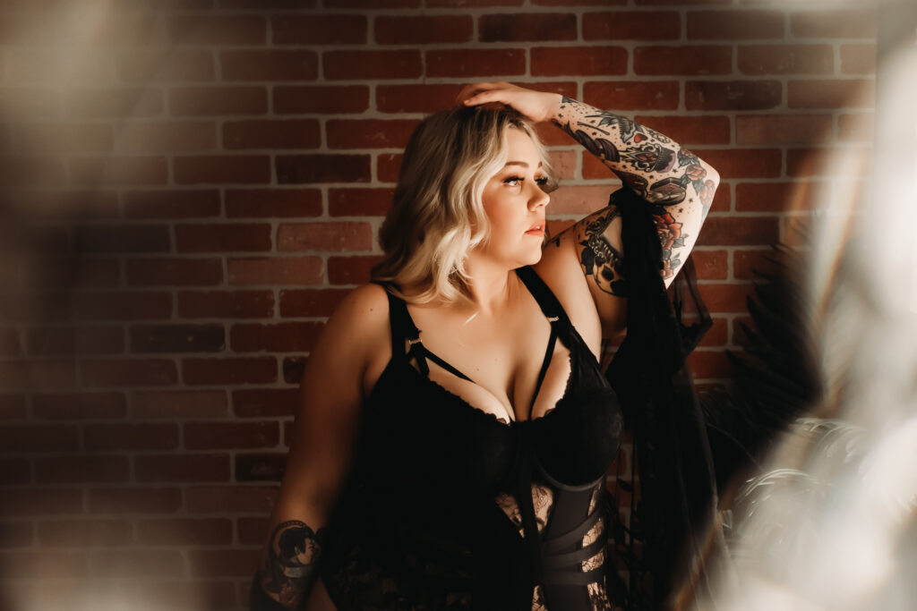 lace black bodysuit / blonde standing in front of brick wall looking out window /  boudoir session / photo by boudoir by vanessa summers of st. louis, mo. see more at www.stlboudoirphotographer.com/blog